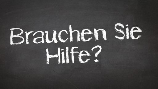 Auf einem Schild steht 'Brauchen Sie Hilfe?' (Foto: colourbox)